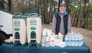 Volunteer Paul Hecht helps out with hot coffee from Hampton Coffee Company