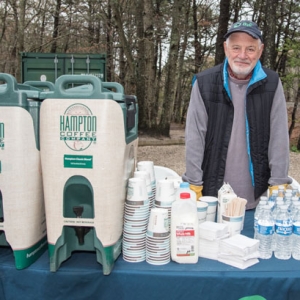 Volunteer Paul Hecht helps out with hot coffee from Hampton Coffee Company