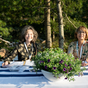 Volunteers Emily Prager and Mary Canfarotta help check-in guests.  Photo by Mark Kopko.