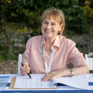 Volunteer Shari Thompson greets guests at check-in. Photo by Mark Kopko Photography.