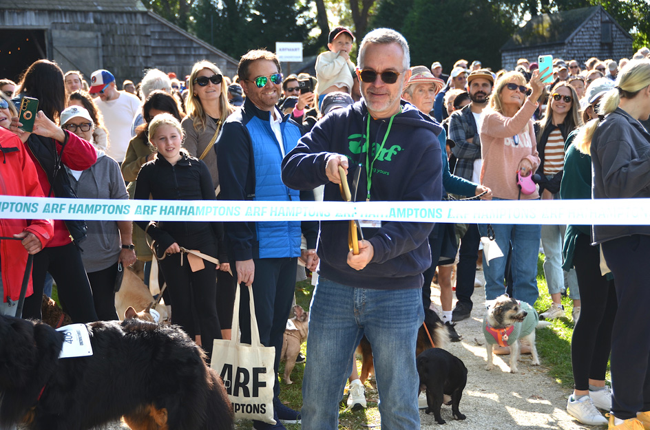 Majo Prazenec, one of ARF's top fundraisers last  year cuts the ribbon to start this year's walk!
