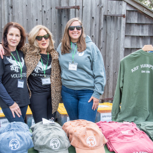 ARF Volunteers Maura Kinney, Edmar Petterson and Nicole Barylski help with ARFmart sales. Photo by Lisa Tamburini.