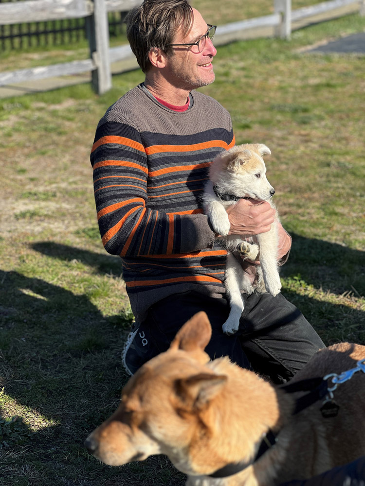 Pilot Dr. Dempsey gets some puppy love on the ground in East Hampton.