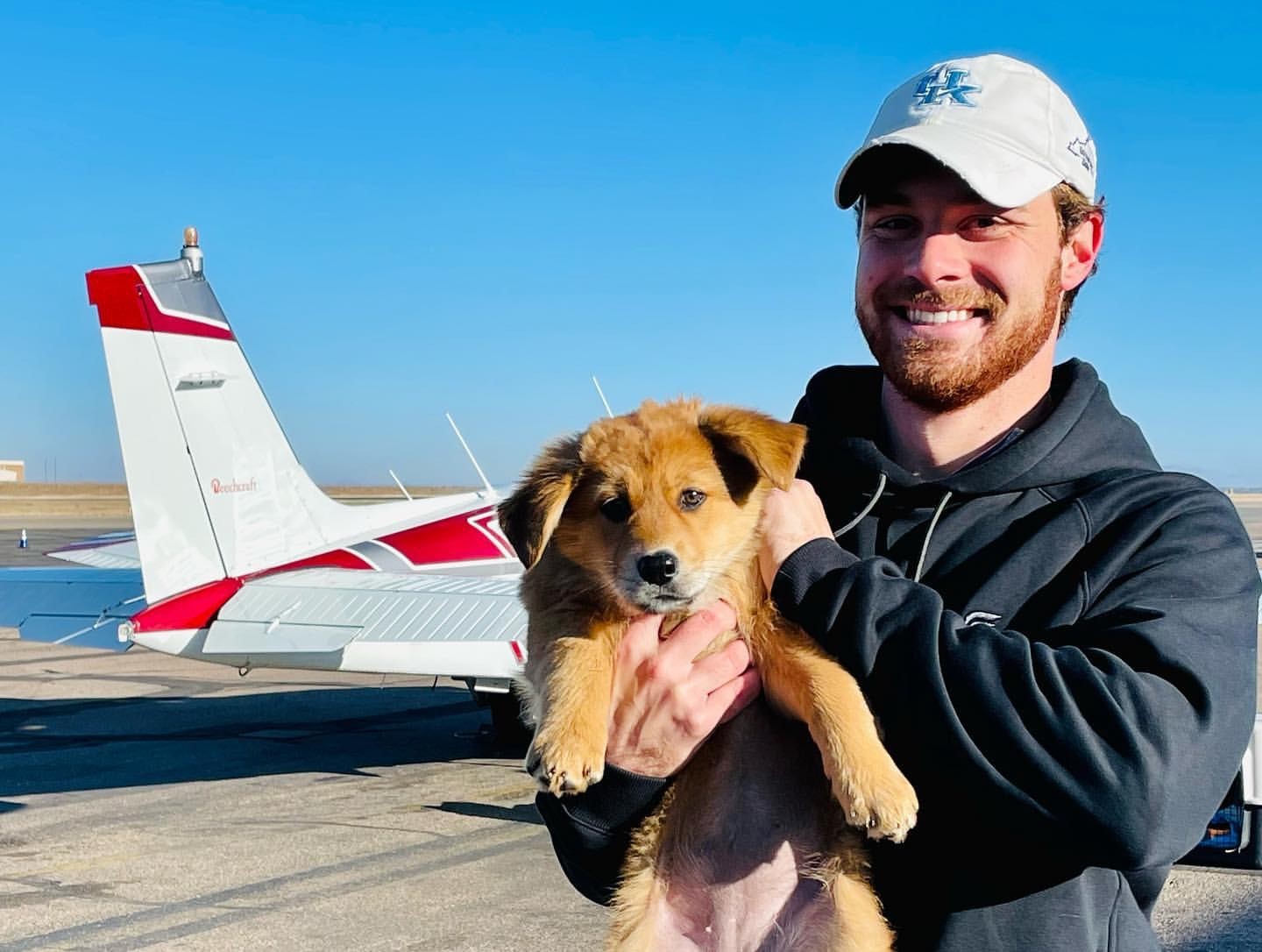 Pilot Matt Pellegrino and puppy are all smiles for the flight.