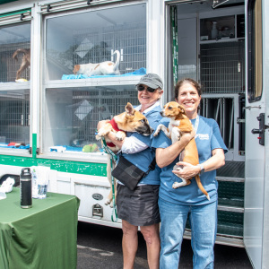 ARF volunteers Carol Holley and Martha Wright showing off some of our adorable puppies available for adoption! Photo by  Lisa Tamburini.